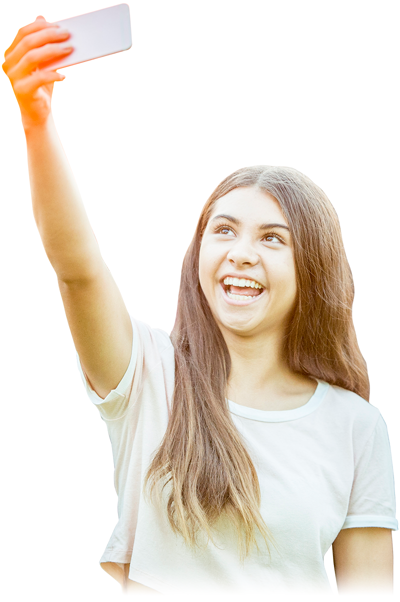 young woman holding up a phone to take a selfie